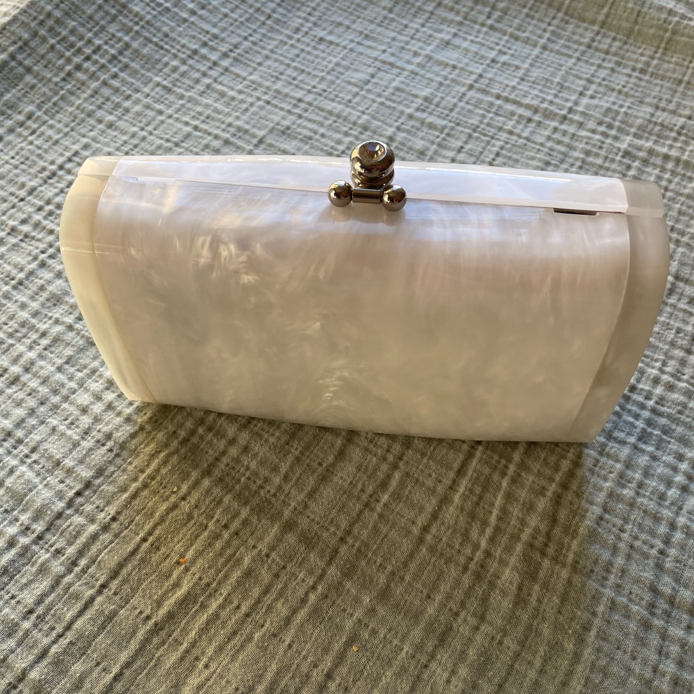 Pearl white  Anthropologie purse. Option to have metal strap. Suede inside.